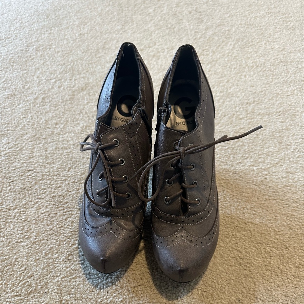 Cute wing-tip brown Guess bootie in size 8.